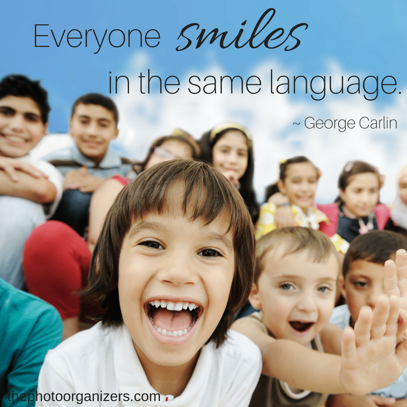 Everyone smiles in the same language. ~ George Carlin | ThePhotoOrganizers.com